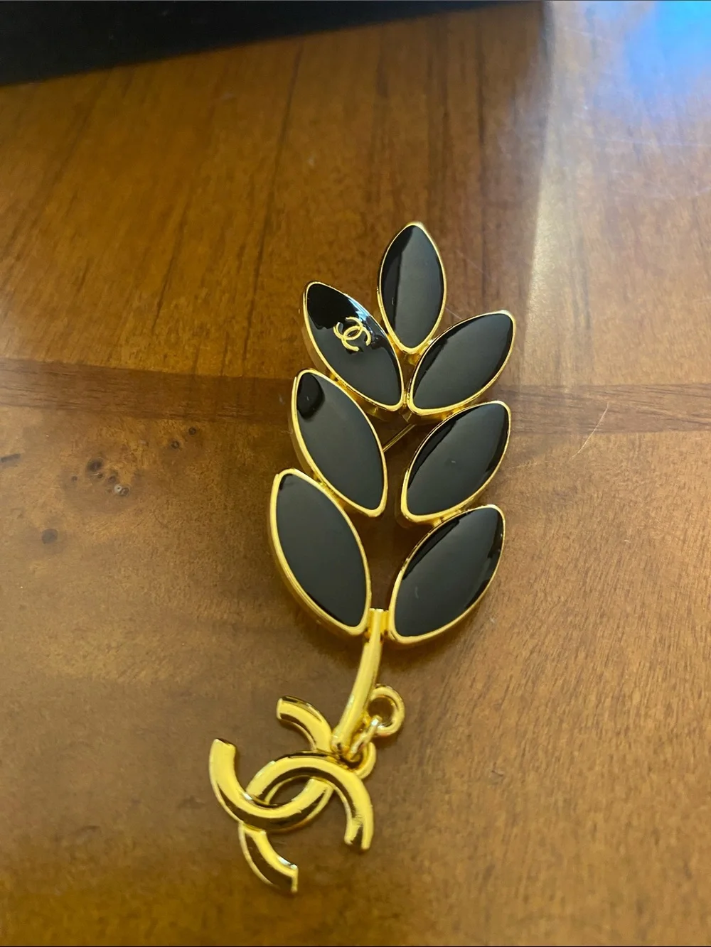 Fashion Jewelry Gold-Tone Leaf Brooch with Black Enamel and CC Logo Charm
